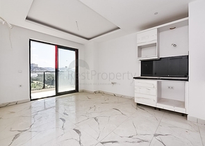 Квартира 1+1 с видом на горы и море в районе Махмутлар