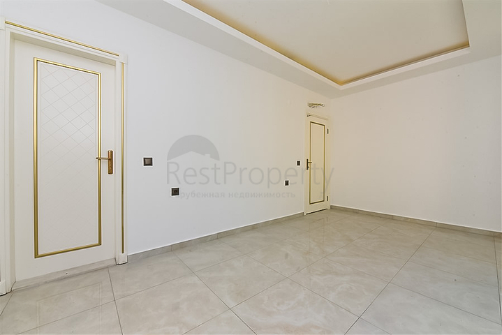 Садовый дуплекс 4+1 с отдельной кухней в центре Алании