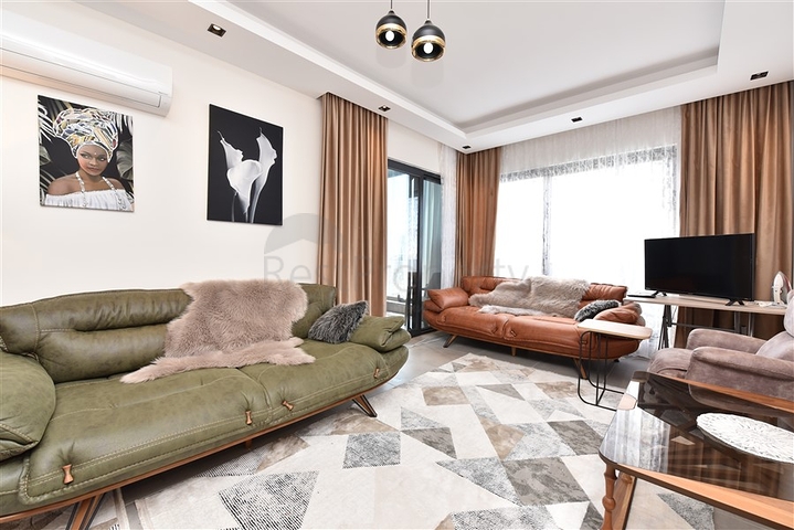 Меблированная двухкомнатная квартира в районе Махмутлар