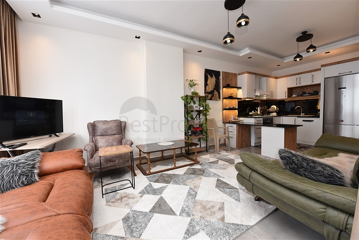 Меблированная двухкомнатная квартира в районе Махмутлар