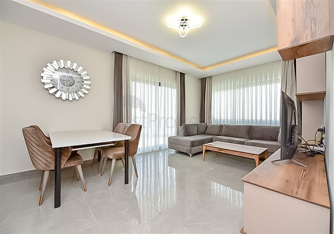 Трехкомнатная квартира в районе Махмутлар с видом на горы