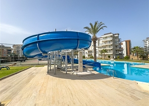 Квартира с просторной планировкой 1+1 в районе Джикджили. 