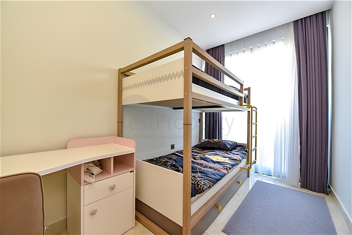 Квартира планировкой 2+1 на первой береговой линии в Махмутлар