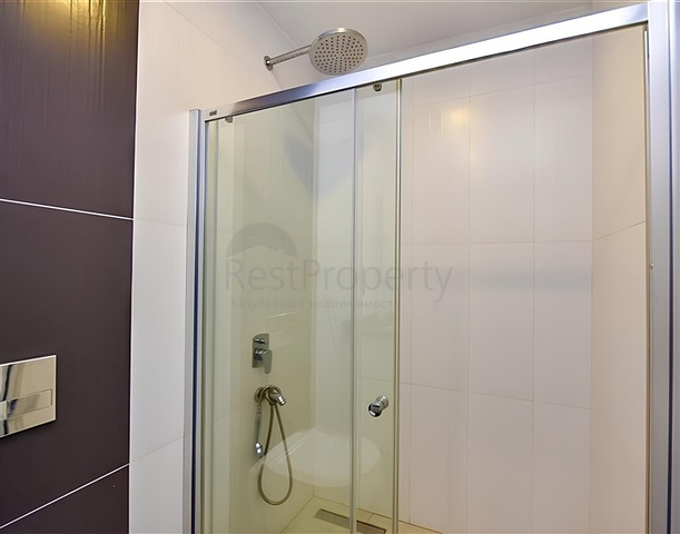 Квартира планировкой 2+1 на первой береговой линии в Махмутлар