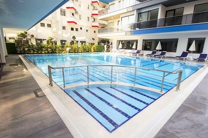 Квартира планировкой 2+1 на первой береговой линии в Махмутлар