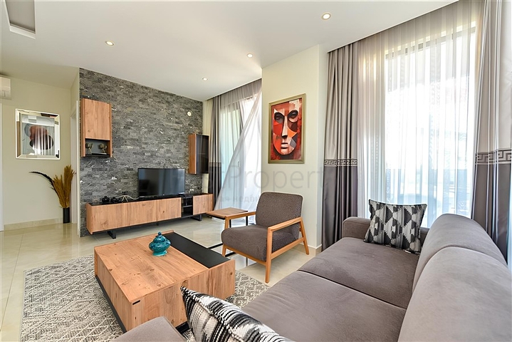 Квартира планировкой 2+1 на первой береговой линии в Махмутлар