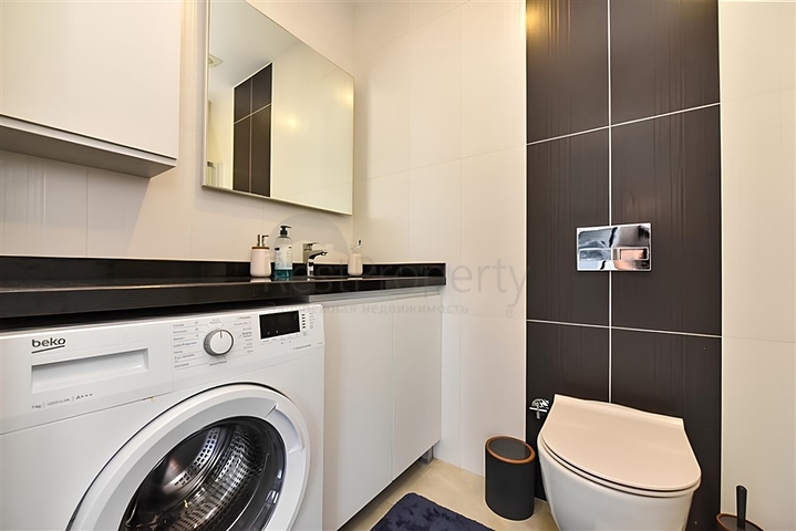 Квартира планировкой 2+1 на первой береговой линии в Махмутлар