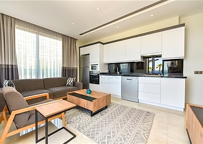 Квартира планировкой 2+1 на первой береговой линии в Махмутлар