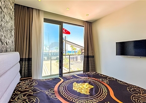 Квартира планировкой 2+1 на первой береговой линии в Махмутлар