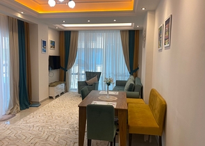 Двухкомнатная квартира в районе Махмутлар