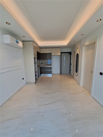 Квартира 1+1 на первой береговой линии в Махмутларе