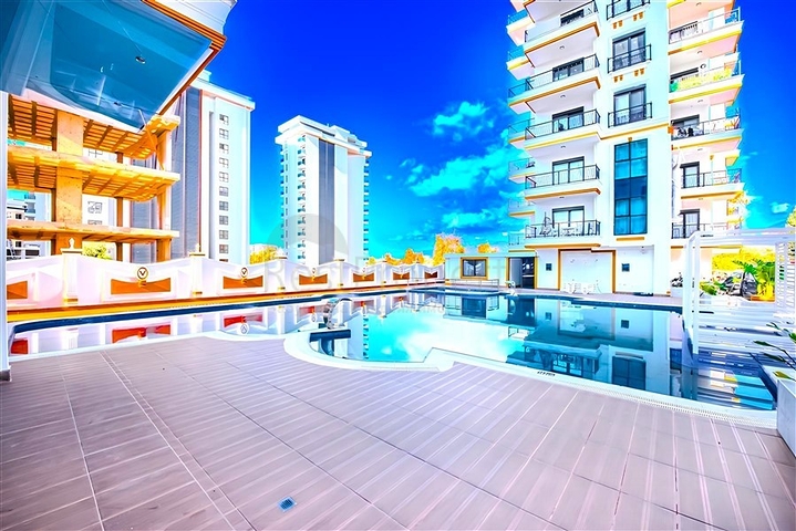 Новый квартира 1+1 в районе Махмутлар