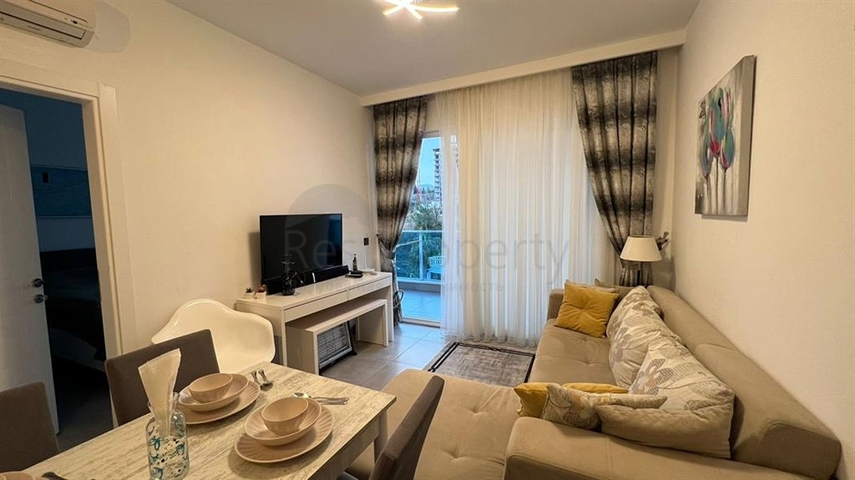 Квартира 1+1 в современном комплексе в районе Махмутлар