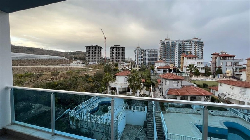 Квартира 1+1 в современном комплексе в районе Махмутлар