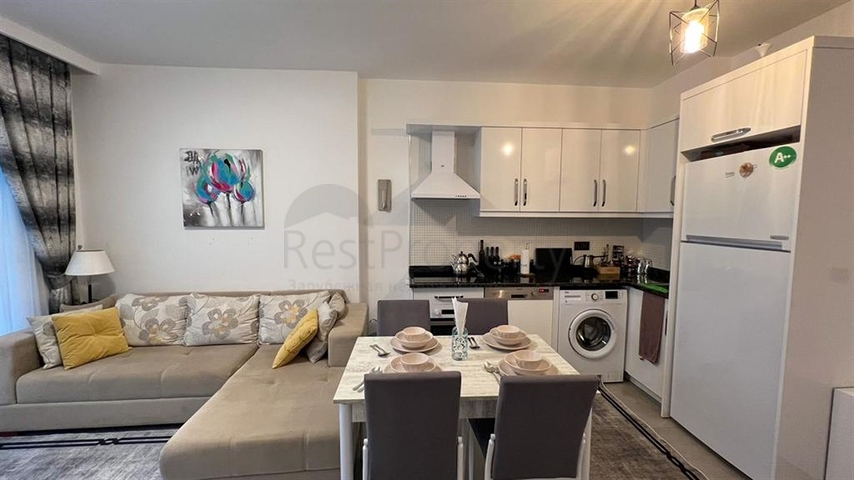 Квартира 1+1 в современном комплексе в районе Махмутлар