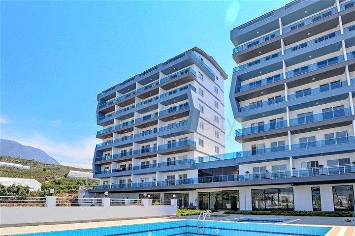 Квартира 1+1 в современном комплексе в районе Махмутлар