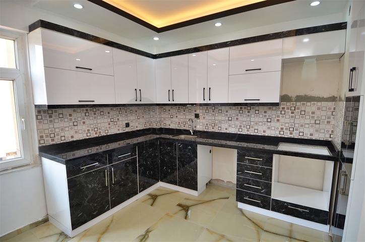 Квартира планировки 2+1 в центре города Анталия 