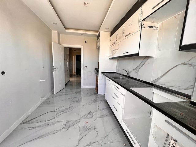 Квартира планировки 4+1 в микрорайоне Конуксявяр - Анталия 