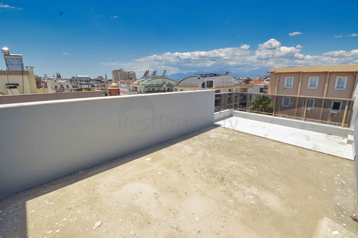 Квартира планировки 3+1 дуплекс в центре города Анталия 