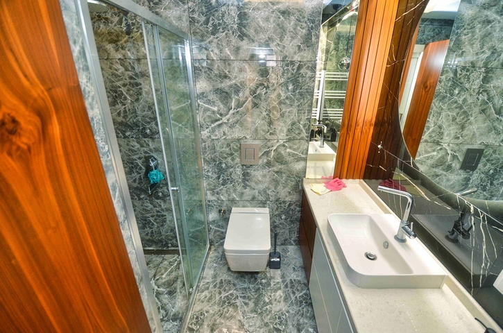 Просторная квартира планировки 4+1 в микрорайоне Унджалы - Анталия 