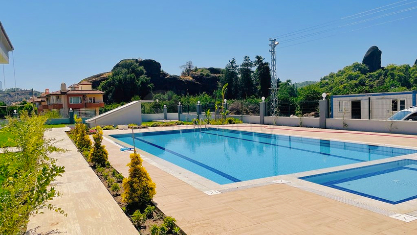 Квартира планировки 3+1 дуплекс в районе Кемер - Анталия 