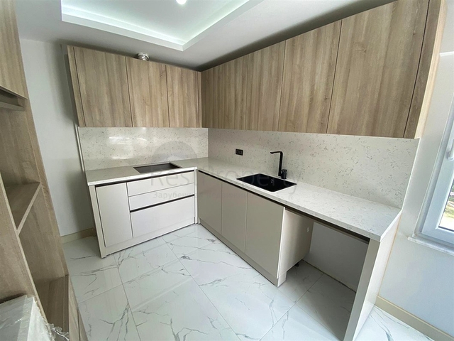 Квартира планировки 3+1 в микрорайоне Гюрсу - Анталия 