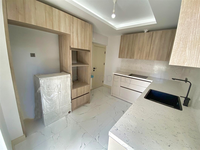 Квартира планировки 3+1 в микрорайоне Гюрсу - Анталия 