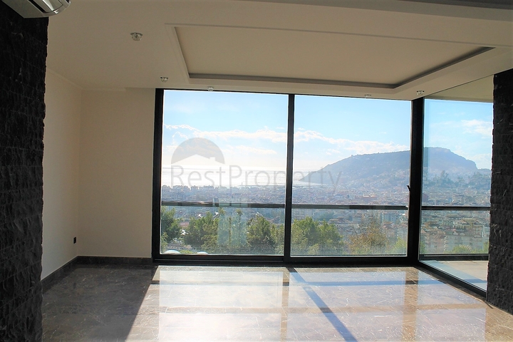 Апартаменты с завораживающим видом в центре Алании