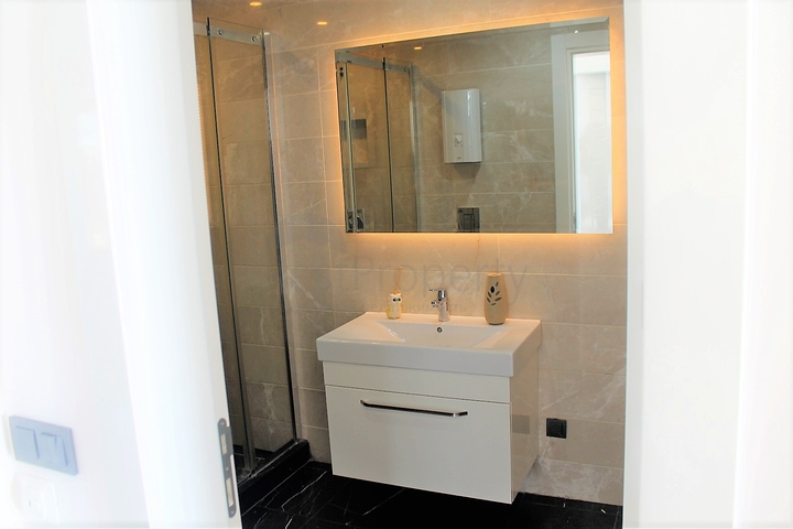 Апартаменты с завораживающим видом в центре Алании