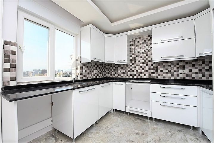 Двухуровневые апартаменты 4+1 в Махмутларе