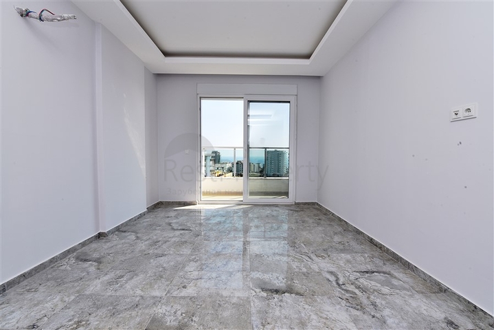 Двухуровневые апартаменты 4+1 в Махмутларе