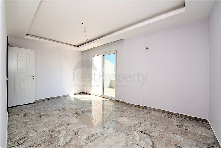 Двухуровневые апартаменты 4+1 в Махмутларе