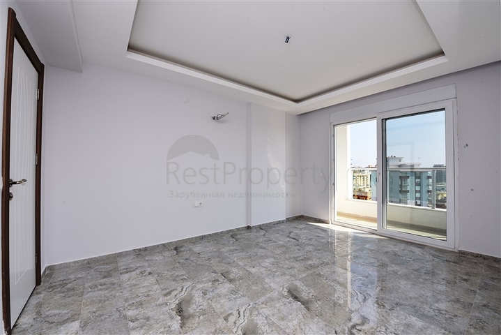 Двухуровневые апартаменты 4+1 в Махмутларе