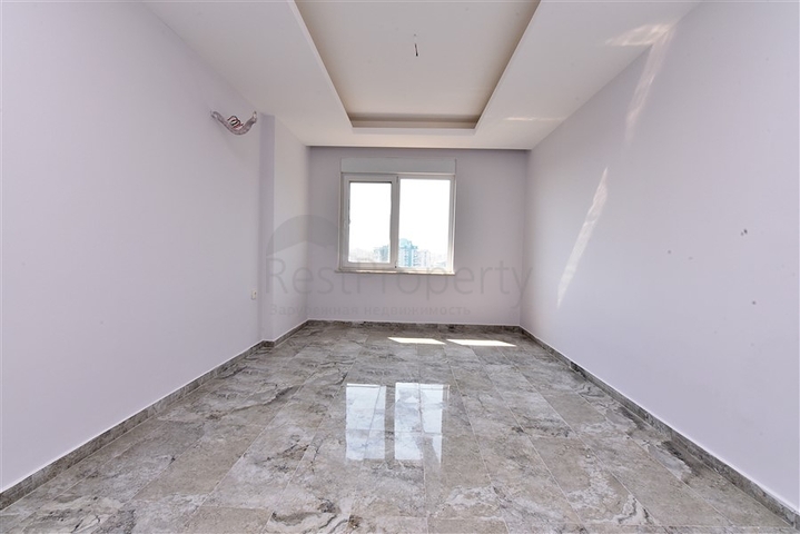 Двухуровневые апартаменты 4+1 в Махмутларе