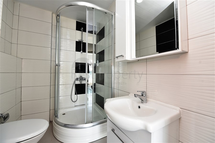 Двухуровневые апартаменты 4+1 в Махмутларе