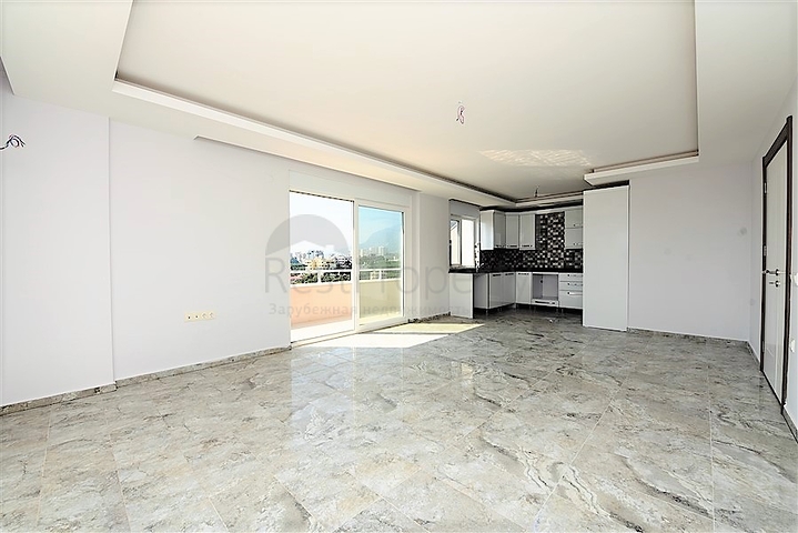 Двухуровневые апартаменты 4+1 в Махмутларе