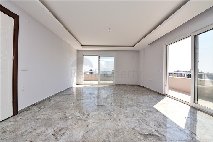 Двухуровневые апартаменты 4+1 в Махмутларе