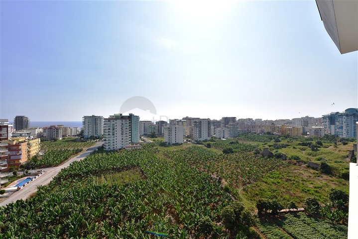 Двухуровневые апартаменты 4+1 в Махмутларе