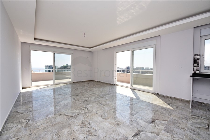 Двухуровневые апартаменты 4+1 в Махмутларе