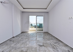 Двухуровневые апартаменты 4+1 в Махмутларе