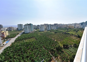 Двухуровневые апартаменты 4+1 в Махмутларе