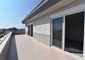 Двухуровневые апартаменты 4+1 в Махмутларе