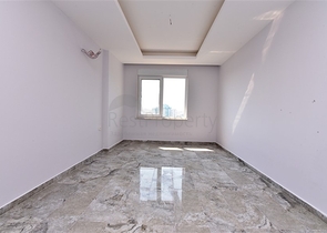 Двухуровневые апартаменты 4+1 в Махмутларе