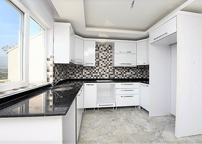 Двухуровневые апартаменты 4+1 в Махмутларе