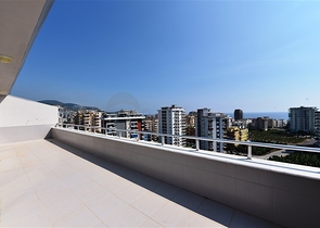 Двухуровневые апартаменты 4+1 в Махмутларе