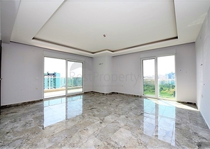 Двухуровневые апартаменты 4+1 в Махмутларе