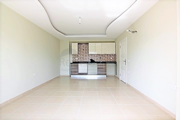 Двухкомнатная квартира в районе Махмутлар