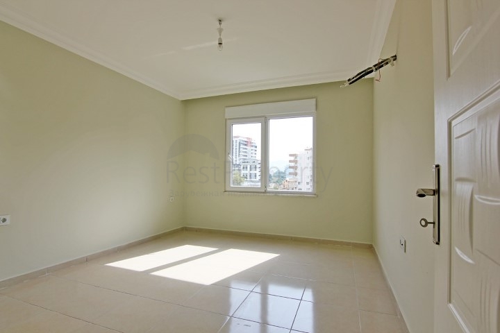 Двухкомнатная квартира в районе Махмутлар