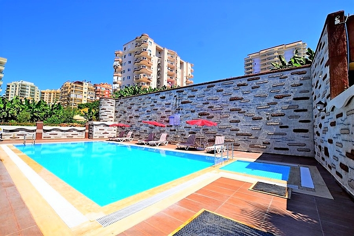 Двухкомнатная квартира в районе Махмутлар