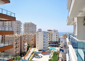 Двухкомнатная квартира в районе Махмутлар